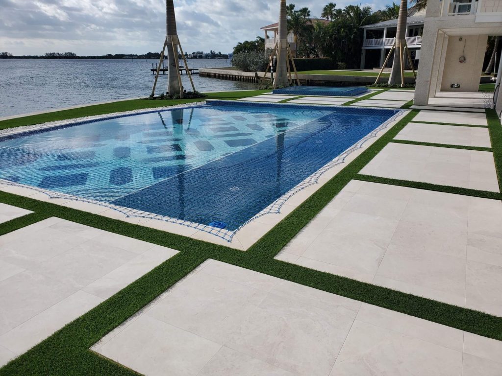 strips of Artificial Grass in Miami surrounding a pool