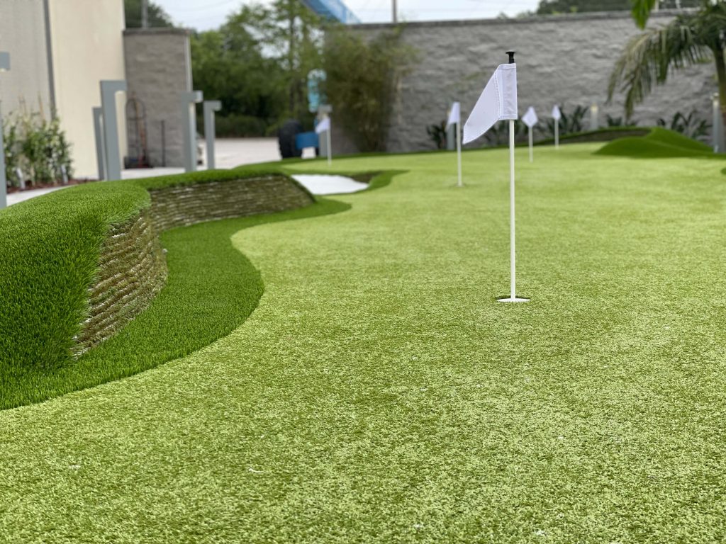 A stacked turf and putting green design completed by Southwest Greens of Florida